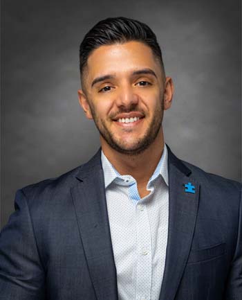 Headshot of Tiron Sela